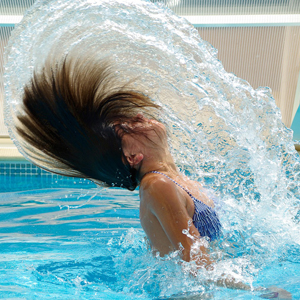 Learn how to prepare your hair for the pool or ocean with these swimmers hair care tips.